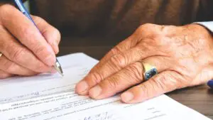Man signing a document