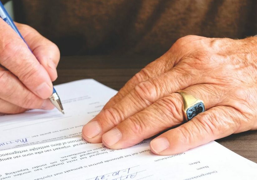 Man signing a document